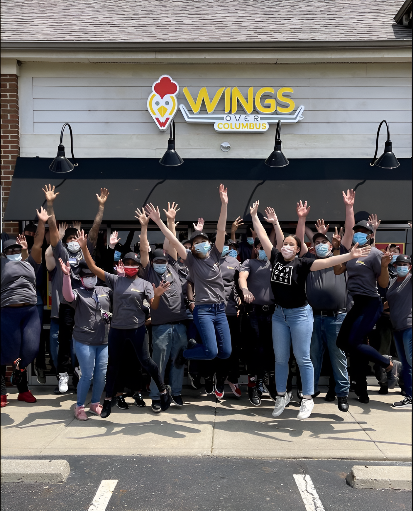 Wings Over Columbus, happy employees cheering after fundraising